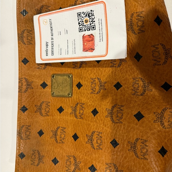 MCM Heritage Tan Clutch with Black Logo and Gold Accent - Picture 16 of 16